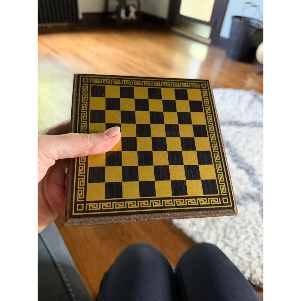 manopoulos chess set with Greek mythology pieces and guide.
